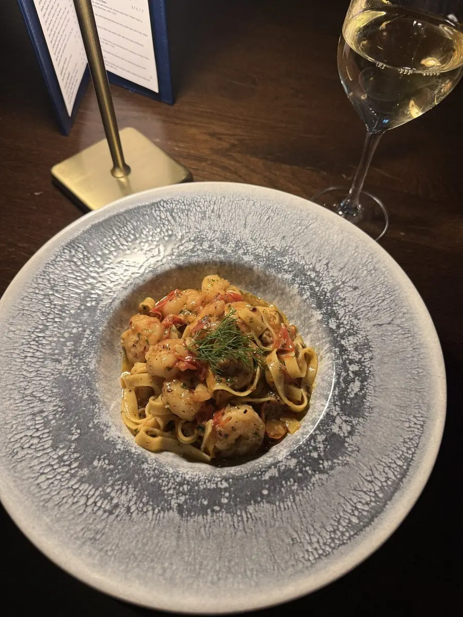 Tagliatelle with chilli garlic prawns at The Reach Riverside, in a speckled grey bowl